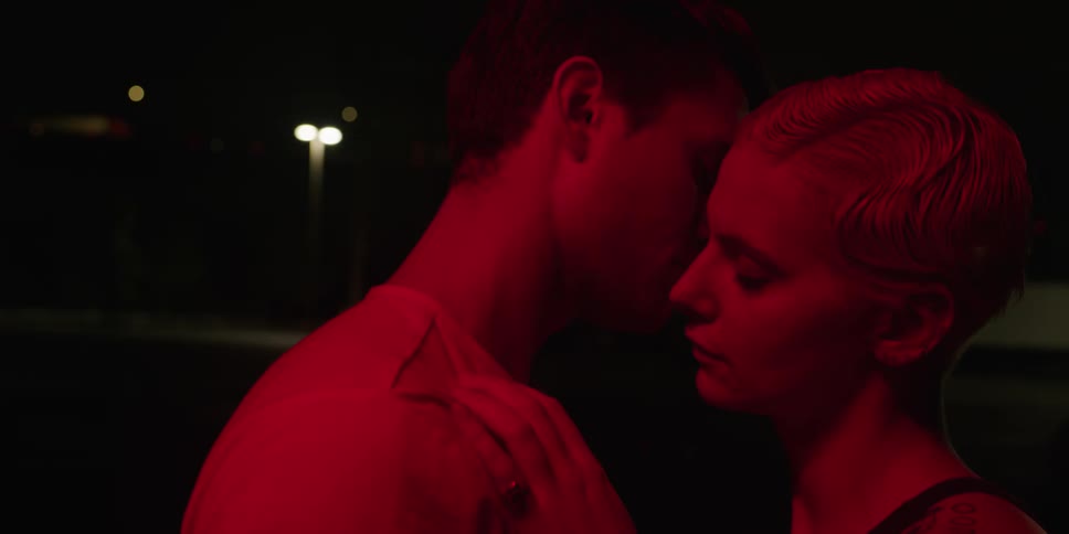 A white man and white woman embrace