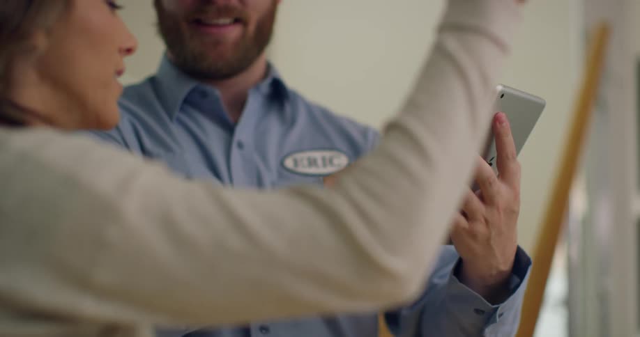 A salesman is talking with a customer
