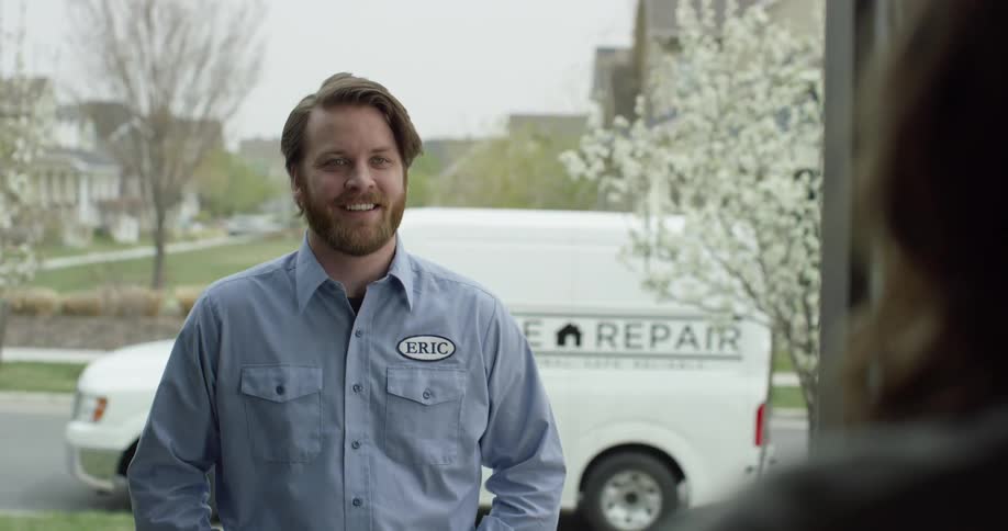 Repair man visiting a home in the suburbs