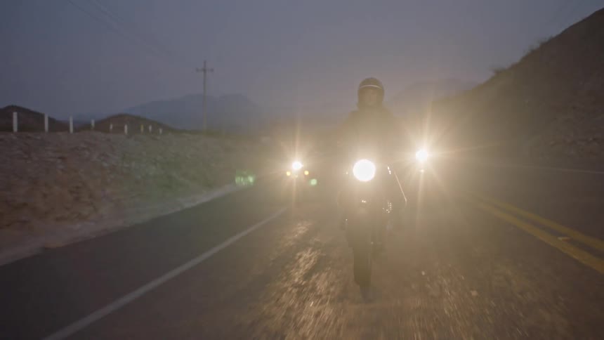 People are riding motorcycles at night