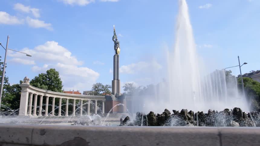Water flows from a fountain near a statue
