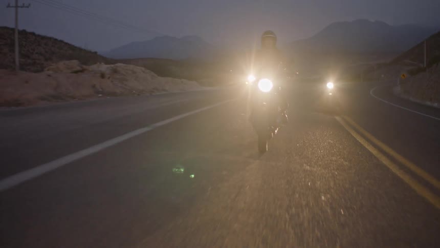 People ride on their motorcycles on the highway