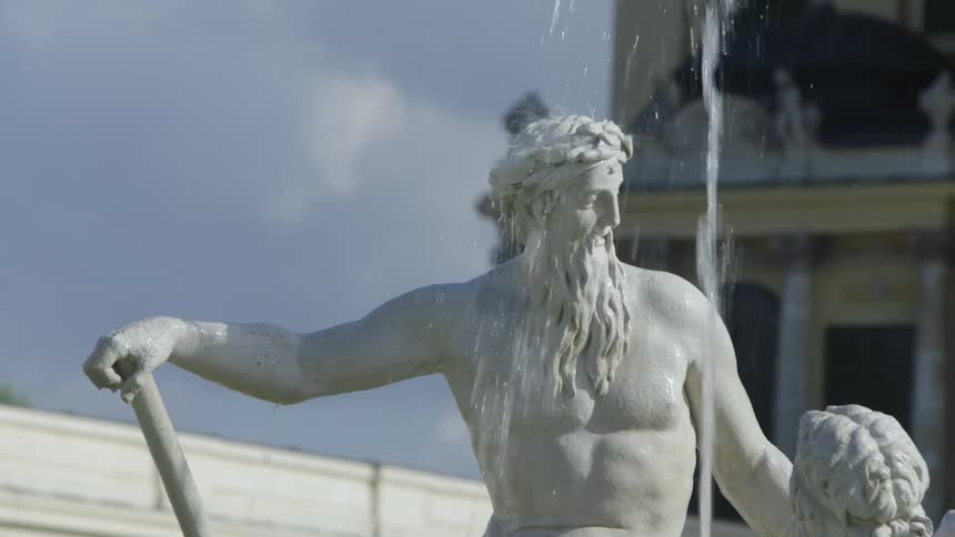 The torso of a statue in a fountain