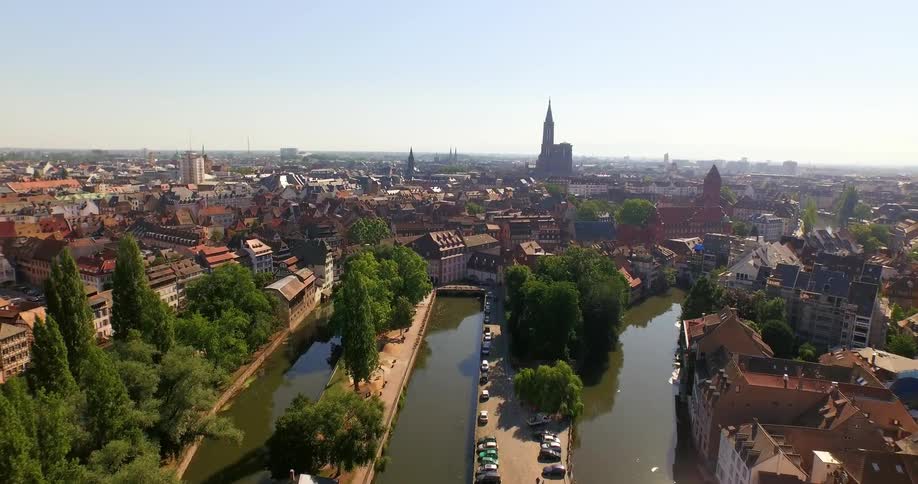 A river with bridges with buildings in the background