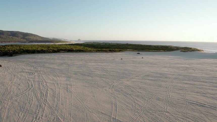 Cars racing on a beach