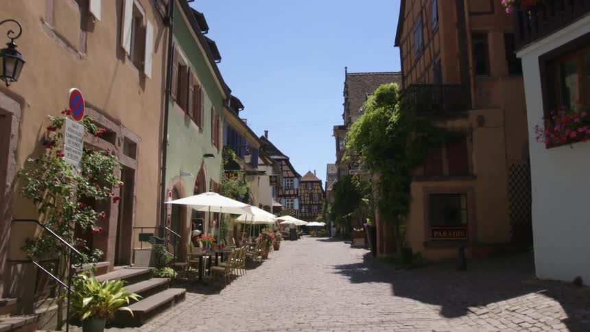 A small neighborhood with a road and a cafe