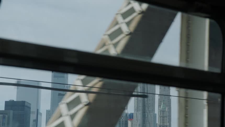 View of new york city skyline from window of rail car