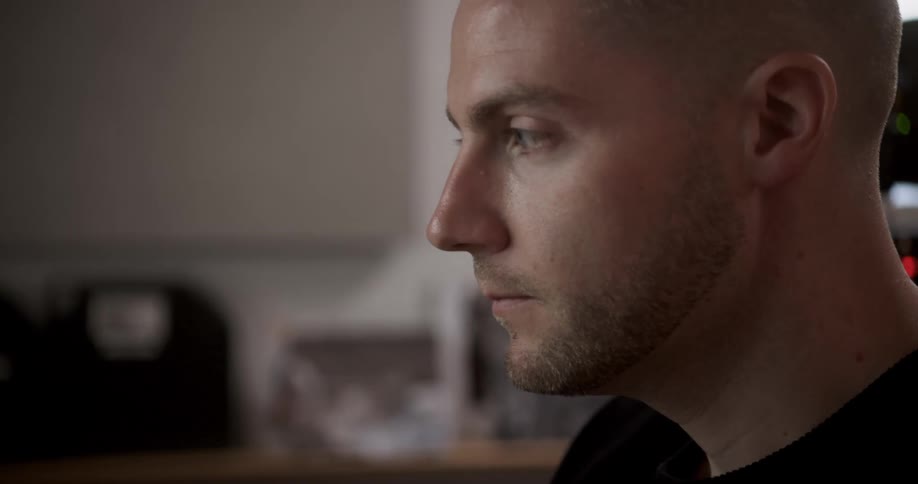 Close up of young man face working in office