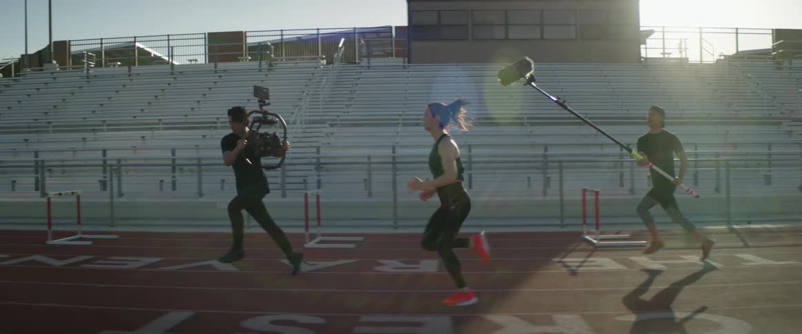 A film crew records a teenager running