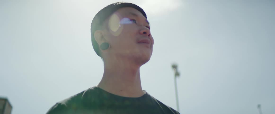 A man standing with the sky in the background
