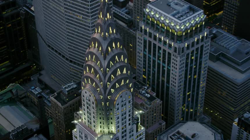 The chrysler building in new york with lights glowing