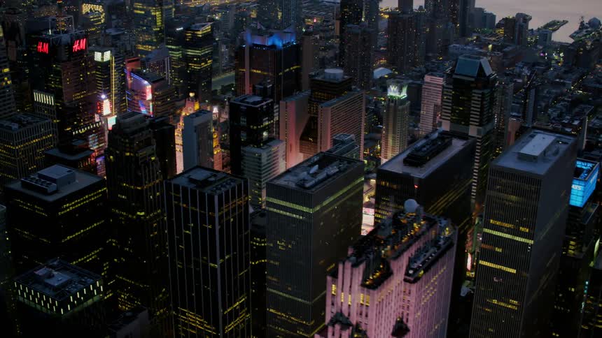Screens and lights light up a part of a citys downtown area
