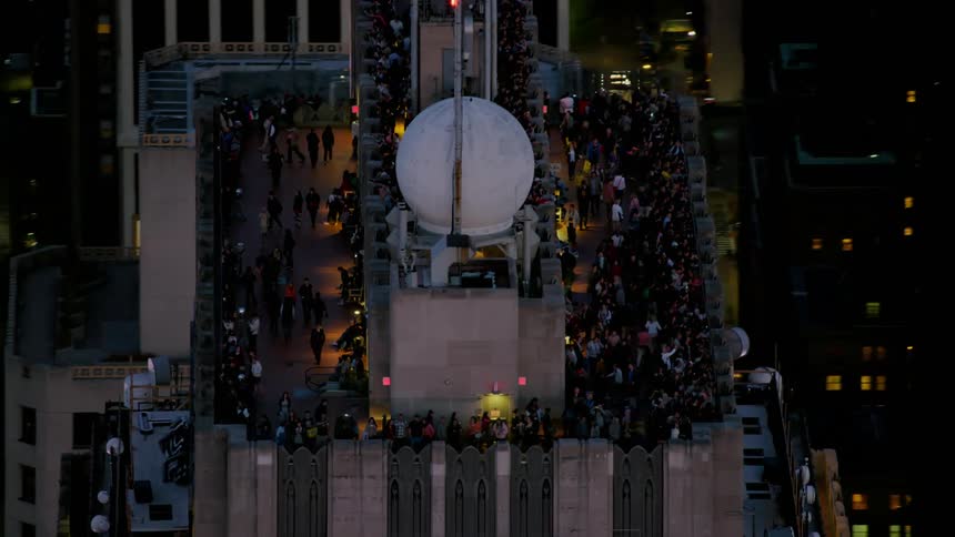People on a rooftop of a skyscraper