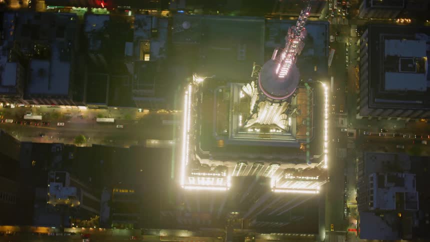 Aerial view of skyscraper in city downtown at night