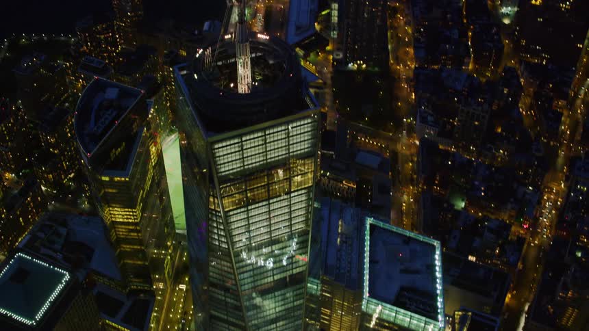 A skyscraper near the coast with streets and buildings