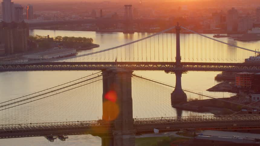 Bridges of new york city at sunset