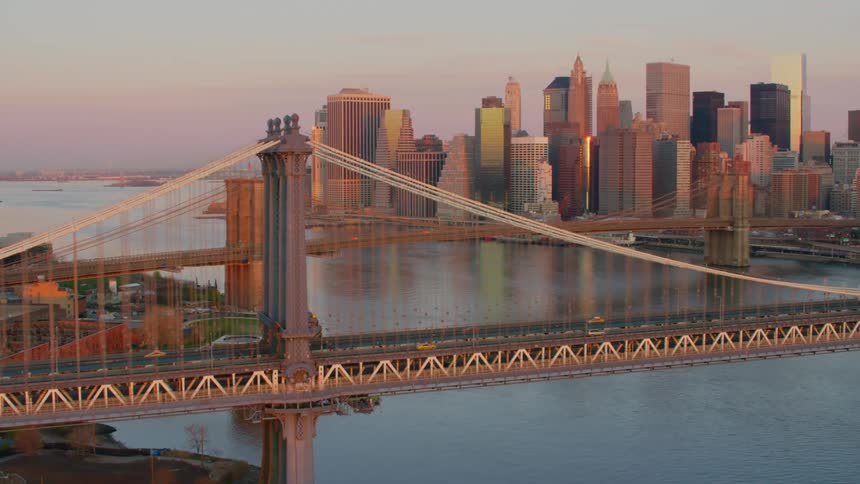 Cars crossing a bridge in to a downtown area