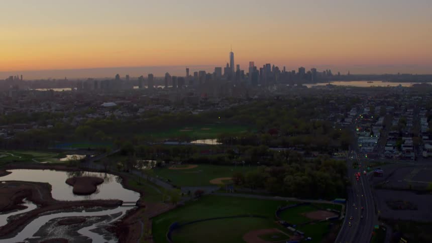 A city skyline sits in the distance