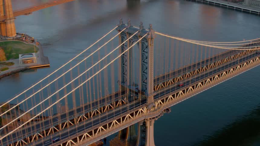 A city with large suspension bridges over a river