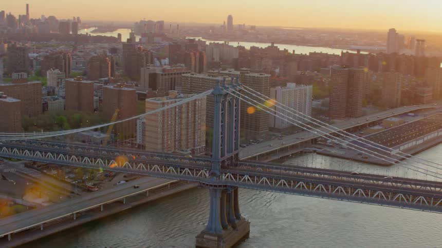 The manhattan bridge over the east river in new york city at sunset