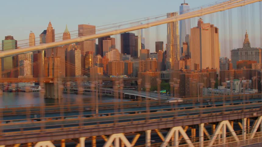 A bridge in front of buildings in a downtown area