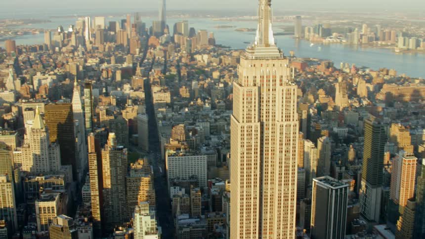 The empire state buildings rises above the city
