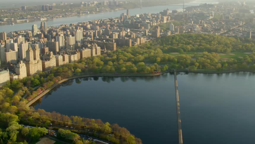 A park with a lake sits in the middle of a dense urban downtown area