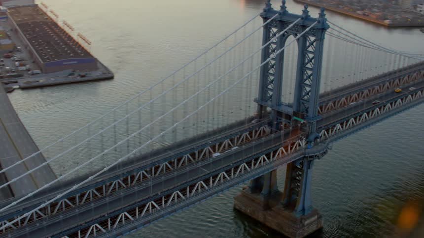 Vehicles travel over the bridge by the city