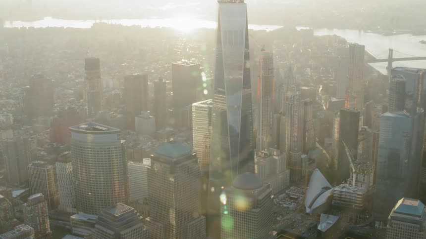 Downtown metropolis with sunrise and glare in background
