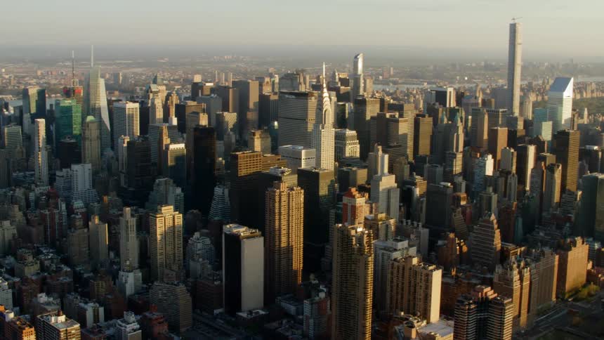 A large city sits on the shore of a body of water