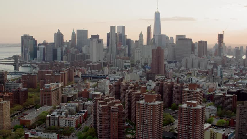 Apartment buildings dot the landscape in front of a downtown city area
