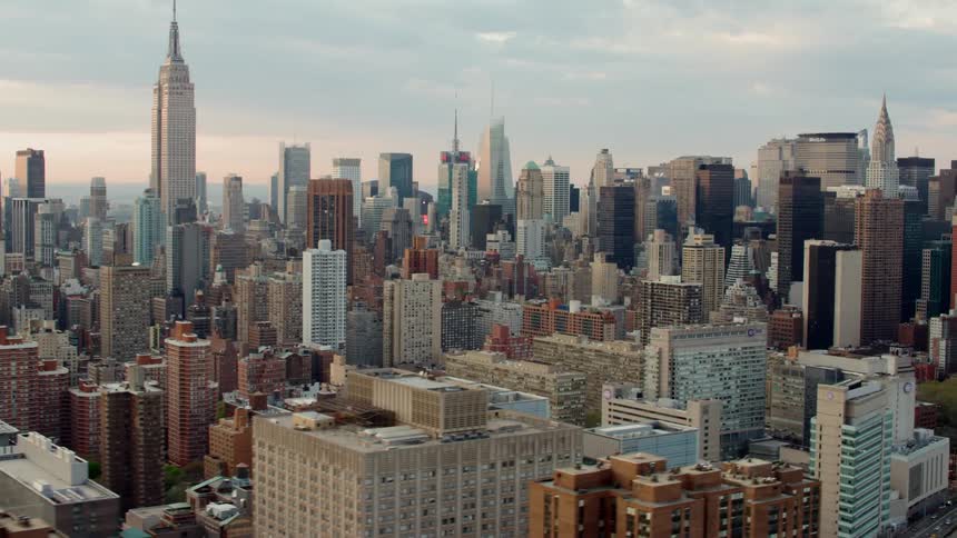 An aerial view of a downtown city is displayed