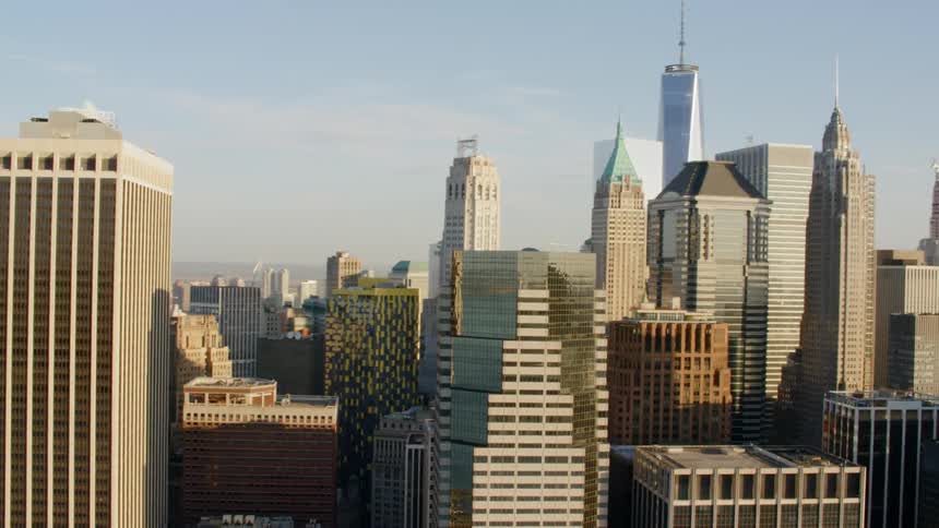 High rises and a large skyscraper make up part of a dense urban downtown area