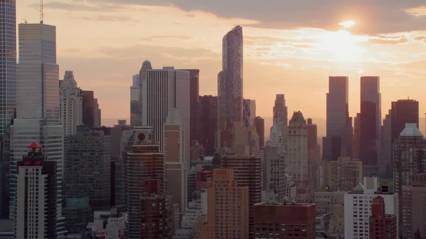 Skyscrapers loom into the sky over a downtown urban area