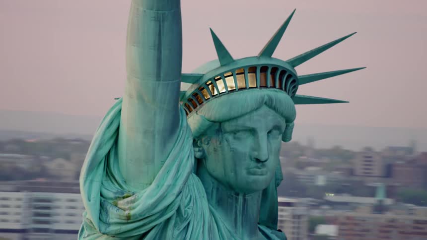 New york city skyscrapers surround the statue of liberty