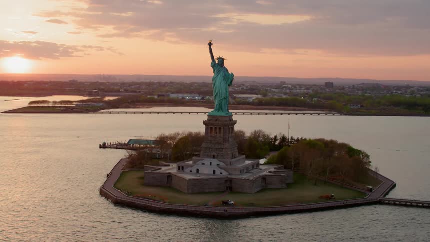 The statue of liberty monument on an island off of new york