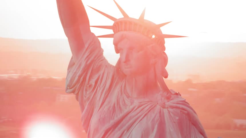 The statue of liberty with the city in the background