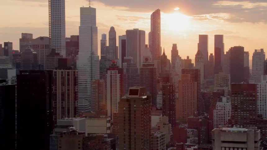 Skyscrapers in a dense urban area stretch up into the sky