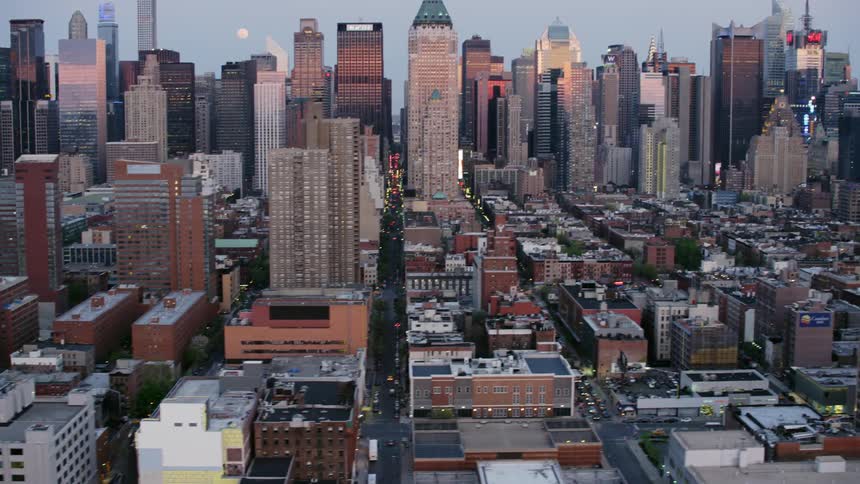 A large downtown area of skyscrapers streets and low buildings