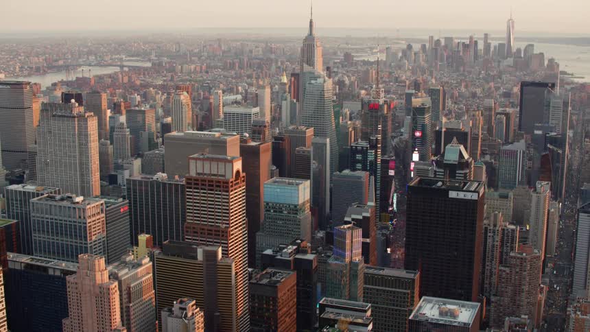 An aerial view of a downtown city is displayed
