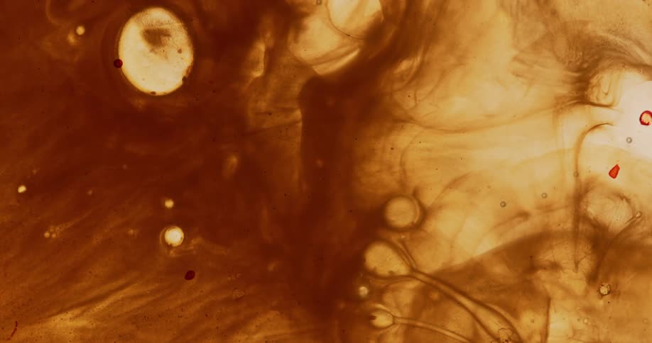 Drips in brown liquid cause vibrations and ripples in a pulsing manner