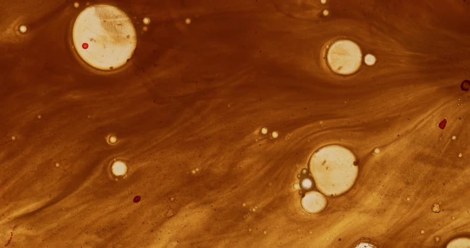 Brown fluid with streaks and bubbles