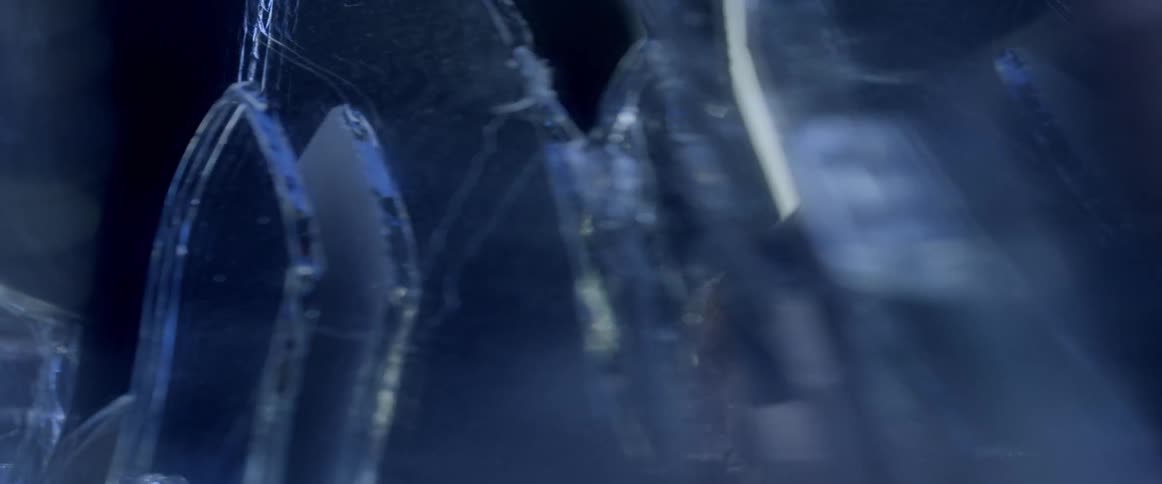 The broken glass shards go out of focus
