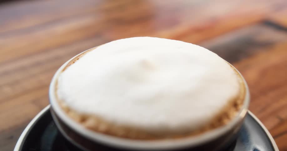 The cappuccino sits on the table