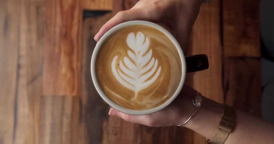 A person is holding a beverage