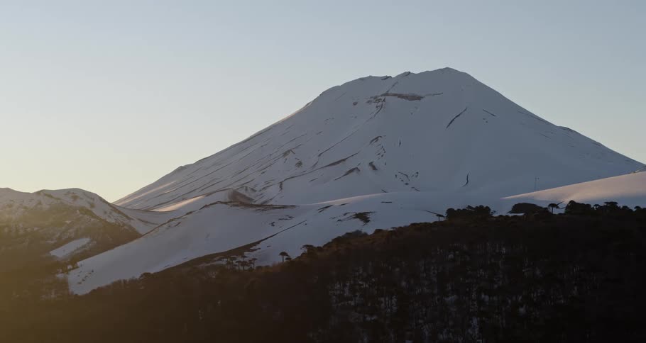 A mountain covered in snow is displayed