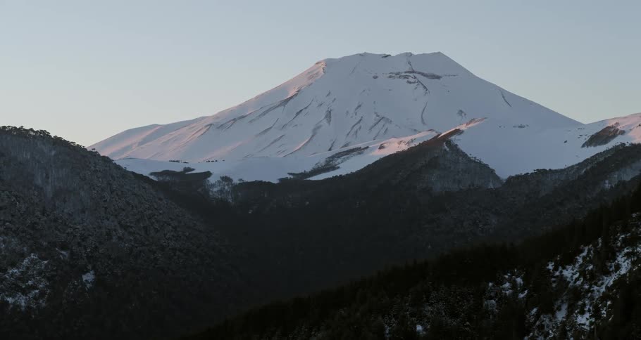 Aerial of a massive volcano at dawn