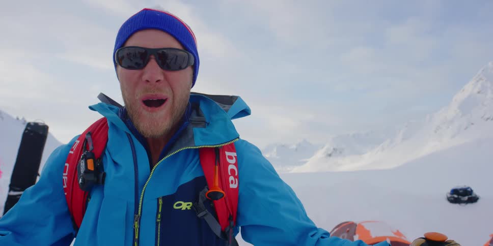 A happy man cries out in the snowy mountains