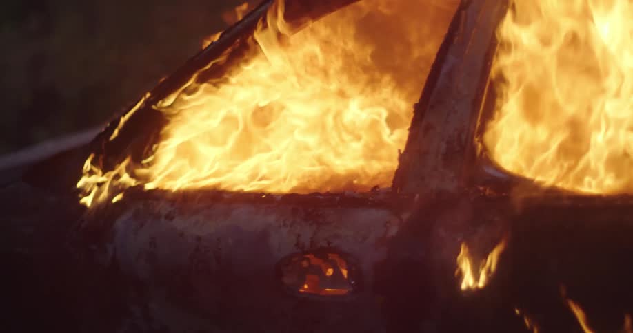 The car is on fire at sunset