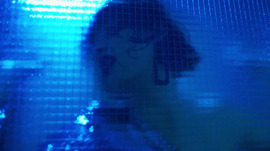 A woman is dancing indoors
